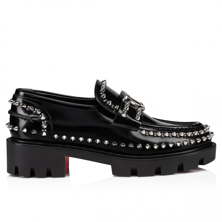 woman christian louboutin spiked loafers